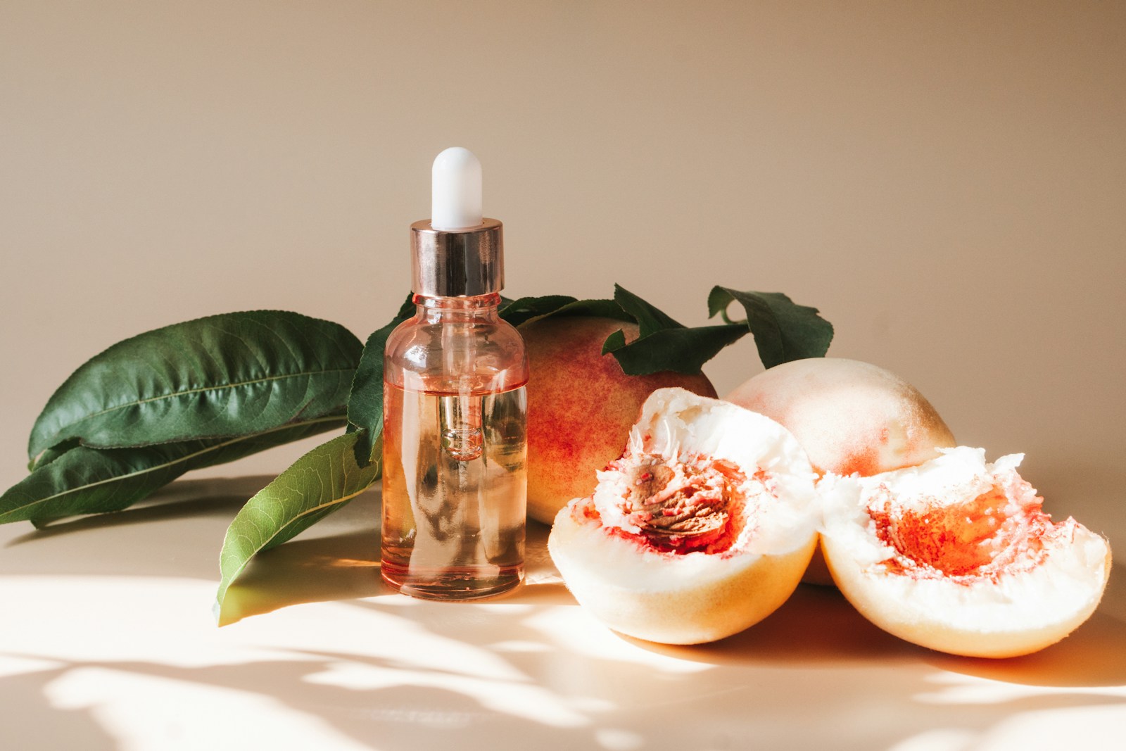 A bottle of lotion sitting next to some fruit